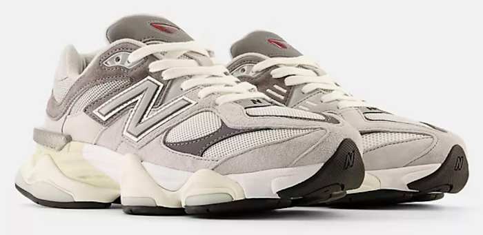 Side view of grey and white New Balance shoes.